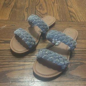 silver braided sandals with brown soles